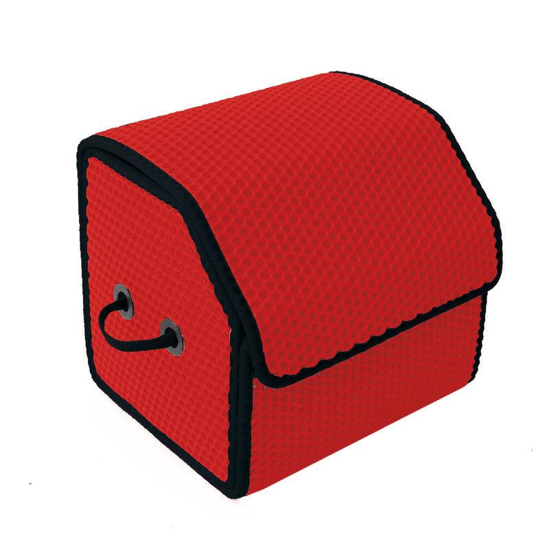 Czerwony organizer z ergonomicznymi uchwytami, wykonany z materiału w strukturalne wzory.