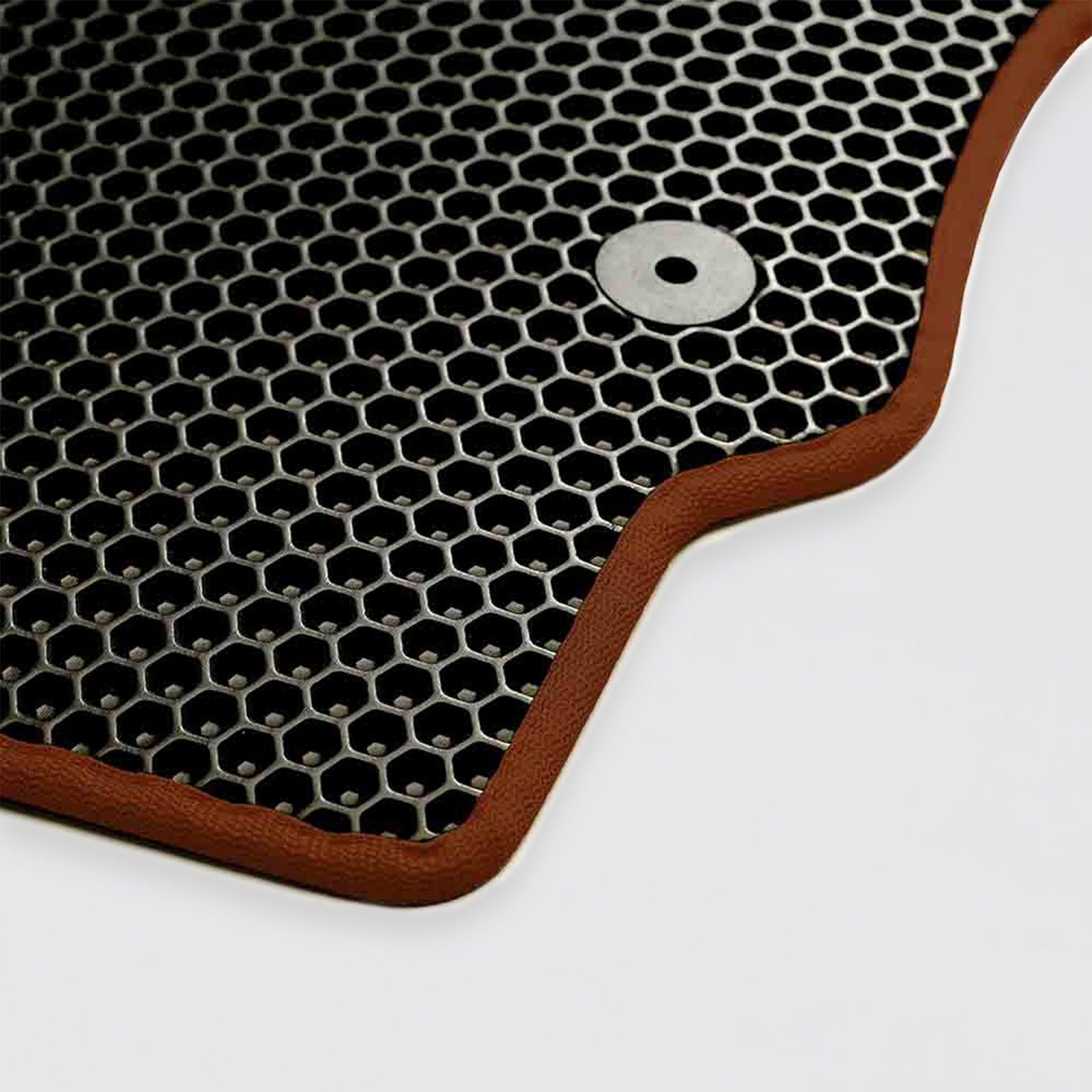 A rubber mat with a hexagonal pattern and brown edges